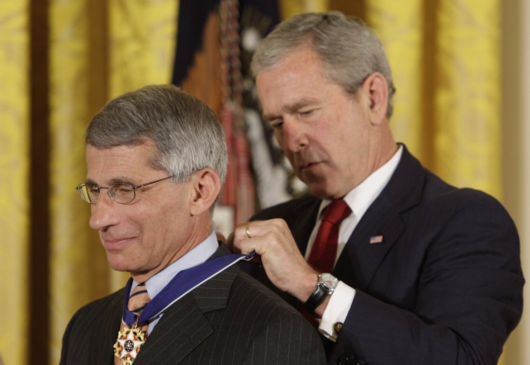 President George W. Bush places the Presidential Medal of Freedom on Dr. Anthony Fauci, the director of the National Institute of Allergy and Infectious Diseases, at the White House in 2008.