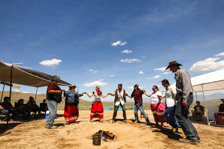 Members of the Fort McDermitt Paiute Shoshone tribe and supporters gather for a circle dance for healing during a gathering in opposition to the proposed lithium mine at Thacker Pass, which has historical significance for the tribe, on June 5, 2021.