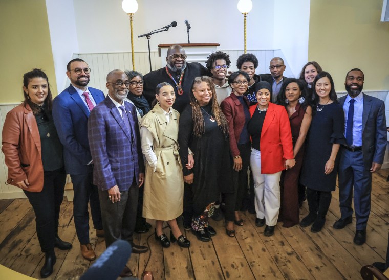 Boston Mayor Michelle Wu, second from right, with members of her new reparations task force at the Museum of African American History on Feb. 7, 2023.