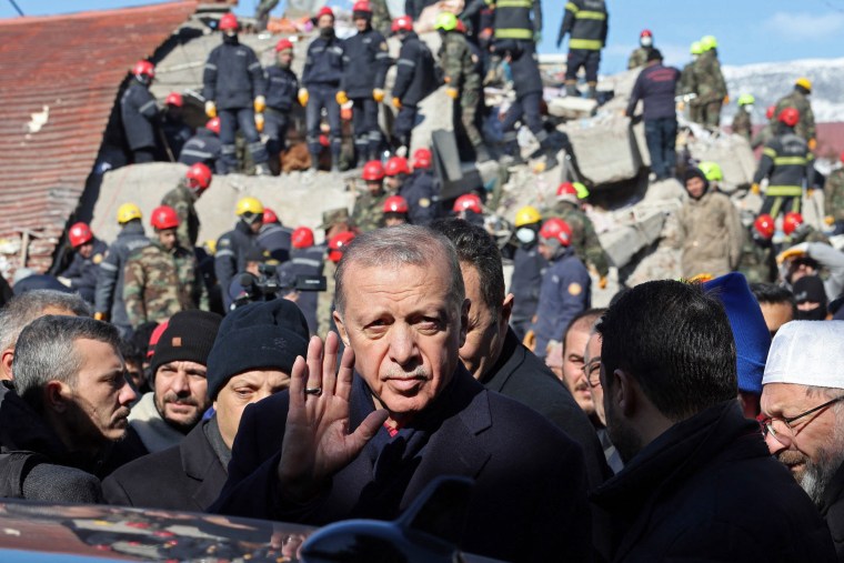 Turkish President Recep Tayyip Erdogan tours the site of destroyed buildings during his visit to the city of Kahramanmaras in southeast Turkey on Feb. 8, 2023. 