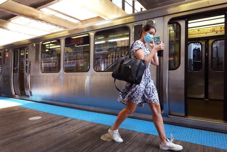 CHICAGO, ILLINOIS - JULY 27: Commuters, most most of whom wear face masks, travel on the L train system in the Loop on July 27, 2021 in Chicago, Illinois. The Centers for Disease Control and Prevention (CDC) is expected to recommend that fully vaccinated people begin wearing masks indoors again in places with high Covid-19 transmission rates as the delta variant begins to cause a spike in coronavirus cases in some regions of the country.