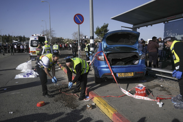 Members of Zaka Rescue and Recovery team work at the site of a car-ramming attack in Jerusalem