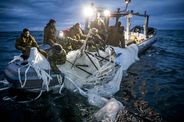 Sailors assigned to Explosive Ordnance Disposal Group 2 recovering a high-altitude surveillance balloon off the coast of Myrtle Beach, S.C., on Feb. 5, 2023.