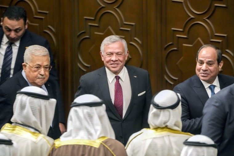 Egyptian President Abdel-Fattah el-Sissi, right, Palestinian President Mahmoud Abbas, left, and King Abdullah II of Jordan, leave a conference to support Jerusalem at the Arab League headquarters in Cairo on Feb. 12, 2023.