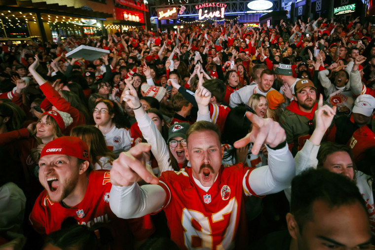 Kansas City Chiefs fans cheer after a touchdown as they watch the Super Bowl LVII NFL between the Chiefs and the Philadelphia Eagles at a watch party in Kansas City, Mo., on Feb. 12, 2023.