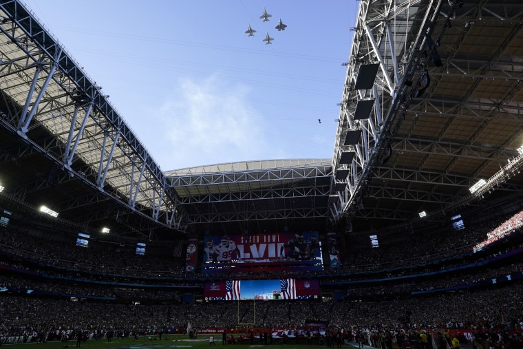 The first all-female piloted military flyover, commemorating 50 years of women flying in the U.S. Navy, flies over State Farm Stadium before the NFL Super Bowl LVII on Feb. 12, 2023, in Glendale, Ariz.