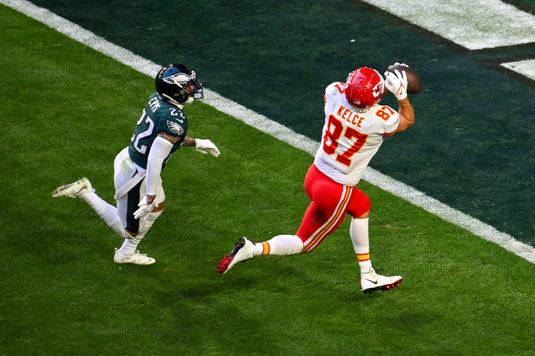 Philadelphia Eagles' safety Marcus Epps runs after Kansas City Chiefs' tight end Travis Kelce as he scores a touchdown during Super Bowl LVII on Feb. 12, 2023.