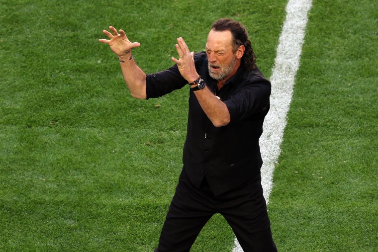 Troy Kotsur signs the national anthem before Super Bowl LVII on Feb. 12, 2023, in Glendale, Ariz.