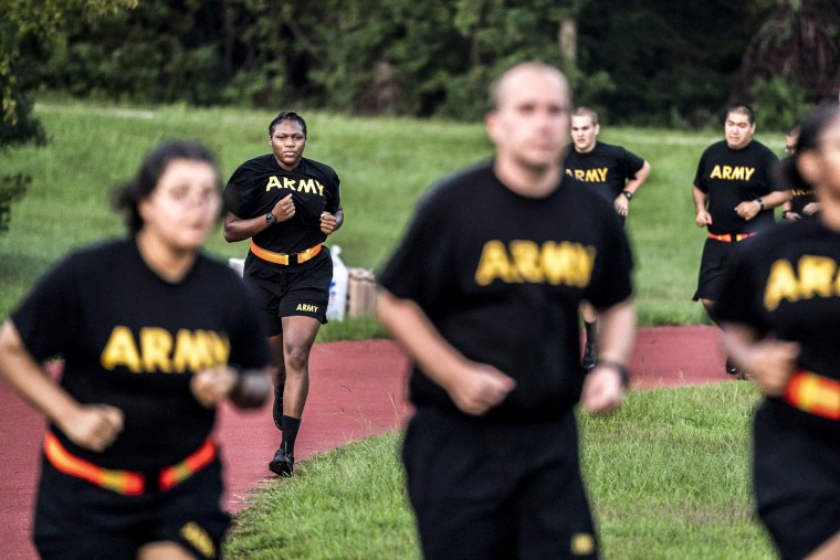 Image: Students in the new Army prep course run around a track during physical training exercises at Fort Jackson in Columbia, S.C., on Aug. 27, 2022.