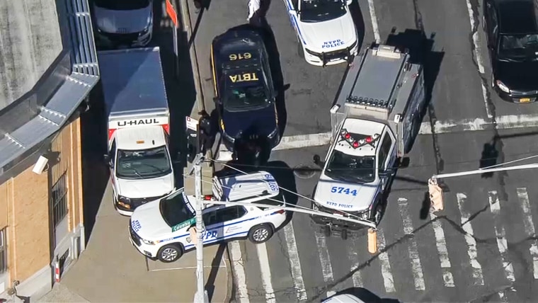 Police surround a U-Haul truck used in suspected hit-and-run in New York on Feb. 13, 2023.