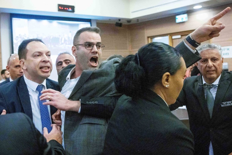 Israeli lawmaker protest inside the Knesset on February 13, 2023 against controversial legal reforms being touted by the country's hard-right government.