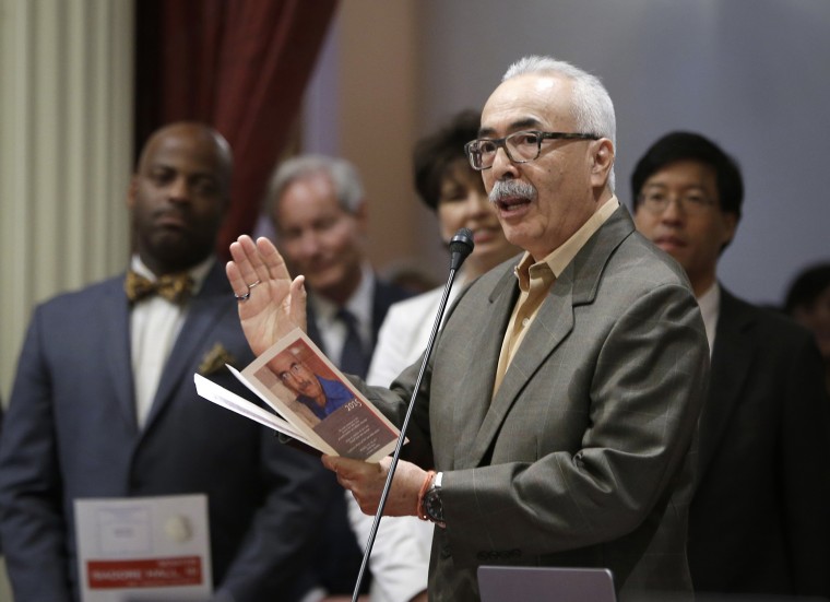 Juan Felipe Herrera reads one of his poems before the California State Senate in 2015.