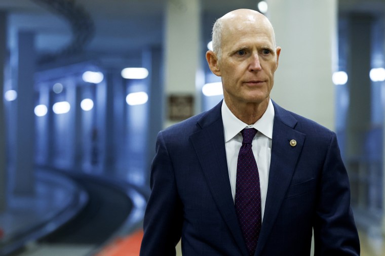 Rick Scott walks to a closed-door, classified briefing for Senators at U.S. Capitol