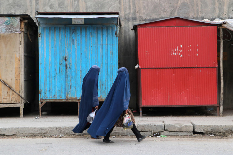Afghan women walk along a street in Badakhshan, Afghanistan