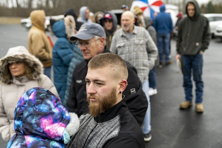 Residents wait in line at the Norfolk Southern Assistance Center to receive a check for $1,000 and reimbursement for expenses incurred during the evacuation in East Palestine, Ohio.