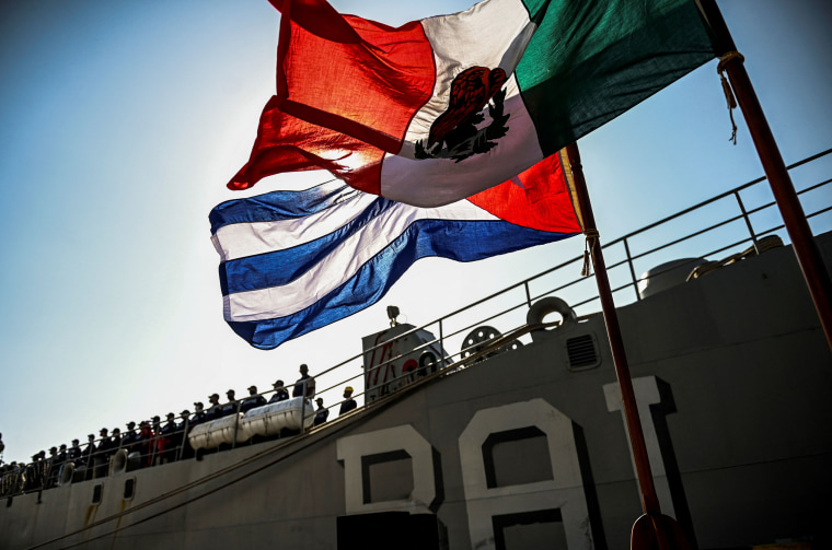 A Cuban and a Mexican flag are seen in front of the Mexican multipurpose vessel Arm Libertador Bal-02 in the port of Havana, on July 30, 2021.
