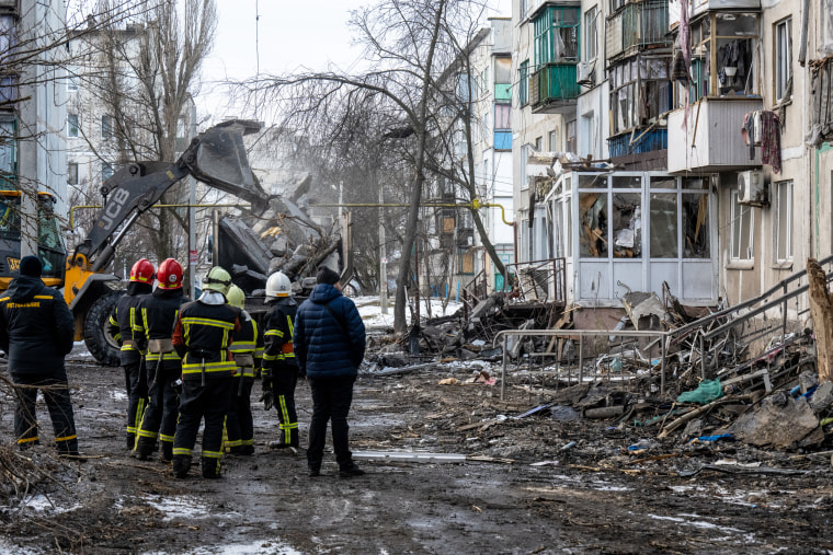 Ukrainian emergency personnel work at a residential apartment building struck by a Russian missile in Pokrovsk, Ukraine