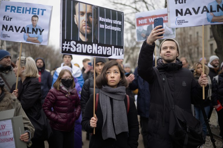 People attend a demonstration demanding the release of Alexey Navalny in Berlin