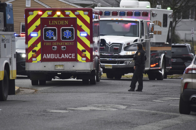 Emergency personnel work at the scene of a shooting in Linden, N.J. 