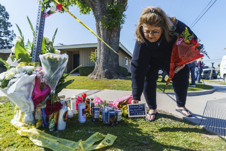 Image: Ramona Torres brings flowers and a framed message to Bishop David O'Connell to pay their respects near his home on February 19, 2023 in Hacienda Heights, California.