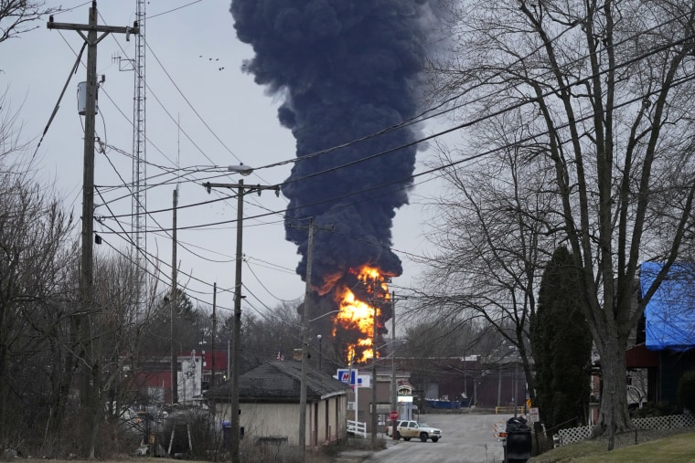 A black plume of smoke rises over East Palestine, Ohio