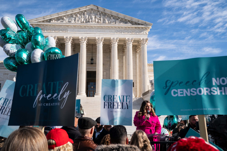 Christian graphic artist and website designer Lorie Smith speaks to supporters outside the Supreme Court