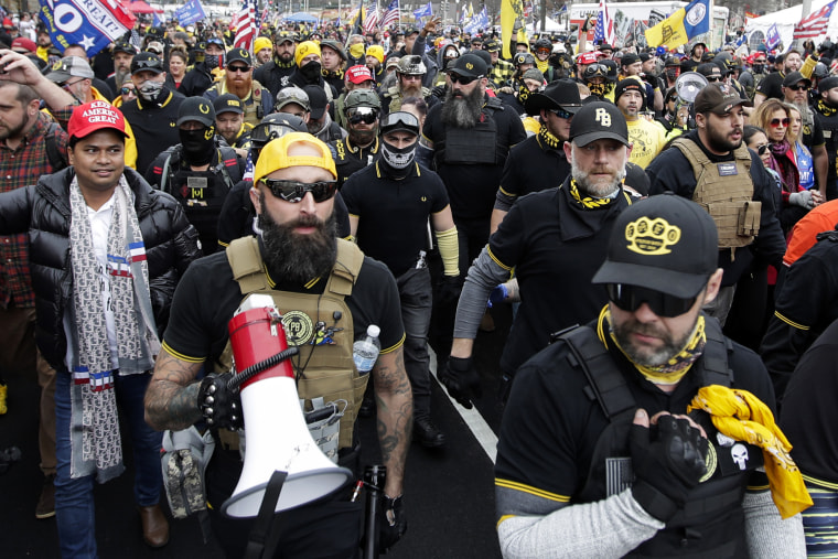 FILE - Proud Boys member Jeremy Joseph Bertino, second from left, joins other supporters of President Donald Trump who are wearing attire associated with the Proud Boys as they attend a rally at Freedom Plaza, Dec. 12, 2020, in Washington. Bertino told jurors on Tuesday, Feb. 21, 2023, that he viewed their far-right extremist organization as "the tip of the spear" after the 2020 election. Bertino is testifying against former Proud Boys national leader Enrique Tarrio and four lieutenants as part of a cooperation deal with federal prosecutors.