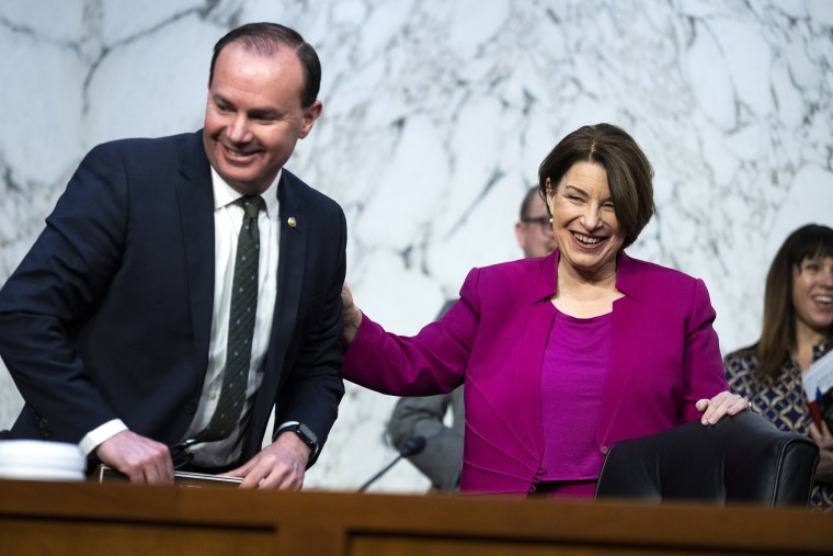 Sen. Amy Klobuchar, D-Minn., greets Sen. Mike Lee, R-Utah., during the Senate Judiciary Committee hearing titled "That's the Ticket: Promoting Competition and Protecting Consumers in Live Entertainment," in Hart Building on Tuesday, January 24, 2023.