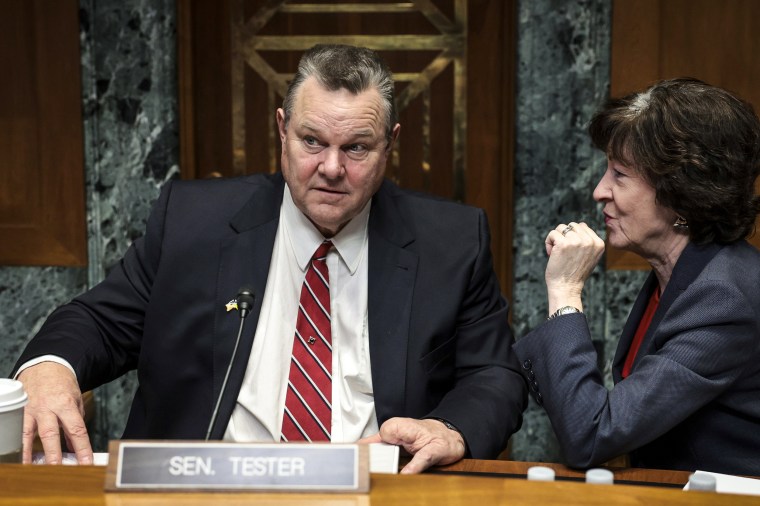 Image: Committee Chairman Sen. Jon Tester, D-Mont., confers with Sen. Susan Collins, R-Maine, after a panel on Feb. 9, 2023.