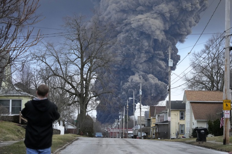 A black plume rises over East Palestine, Ohio, after a controlled detonation of a portion of the derailed Norfolk Southern train