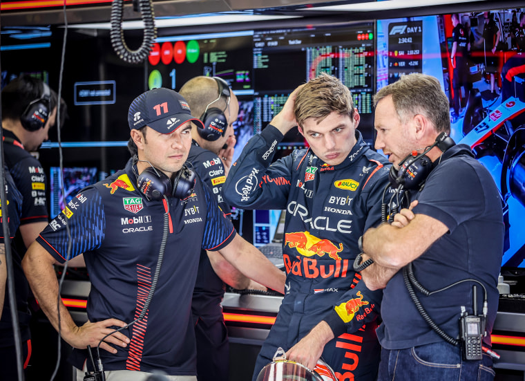 Red Bull's Max Verstappen speaks to the crew before a test drive at Bahrain International Circuit on Feb. 23, 2023.