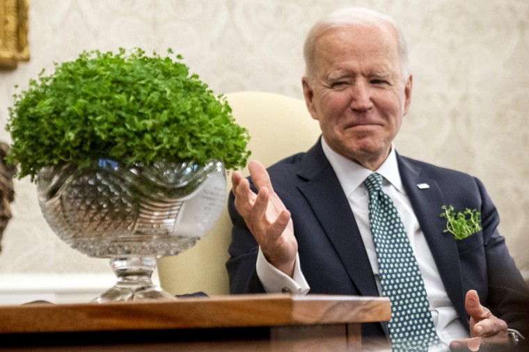 President Joe Biden sits next to a bowl of Irish shamrocks as he has a virtual meeting with Ireland's Prime Minister Micheal Martin on St. Patrick's Day on March 17, 2021.