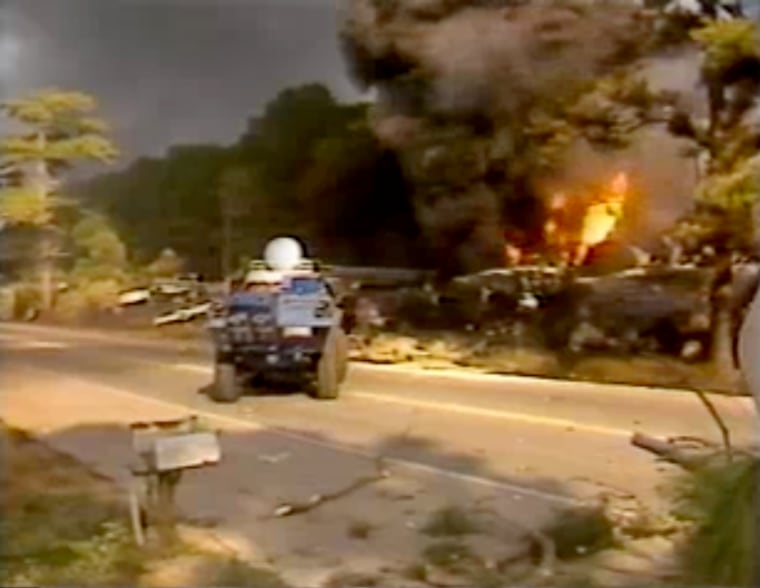 Image: Flames and smoke rise from the 1982 Livingston, La., train derailment.