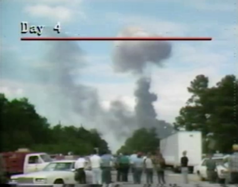 Image: A plume of smoke rises from the scene of a freight train derailment in Livingston, La., in 1982. 