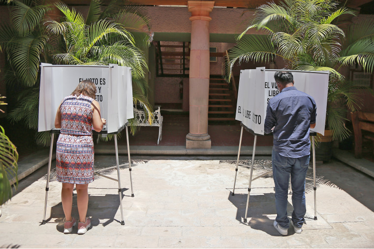 People cast their votes at a polling station in Mexico