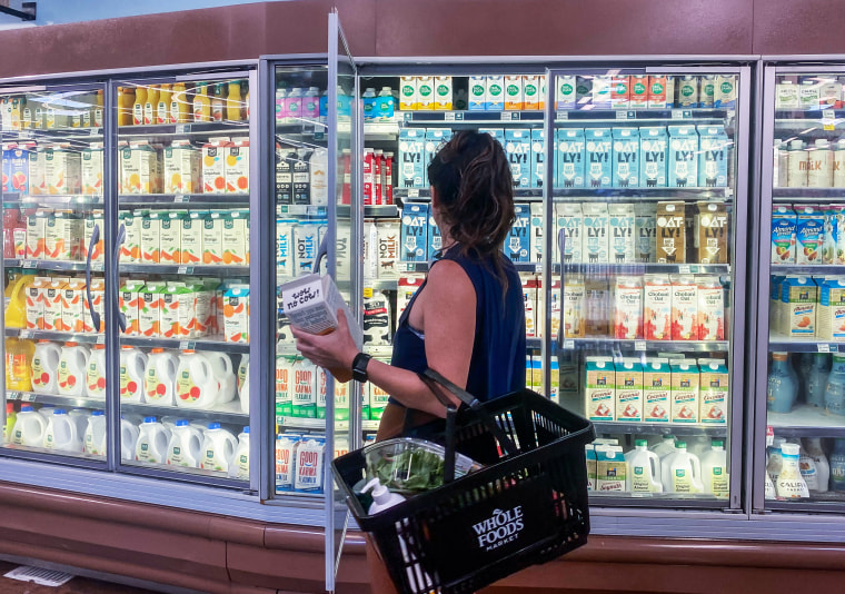 A woman shops for oat milk at a supermarket in Santa Monica, Calif., on Sept. 13. 