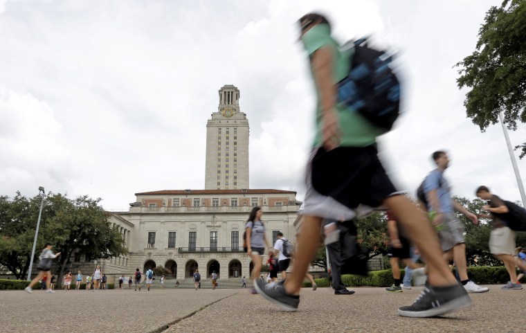 Students walk on campus of University of Texas at Austin