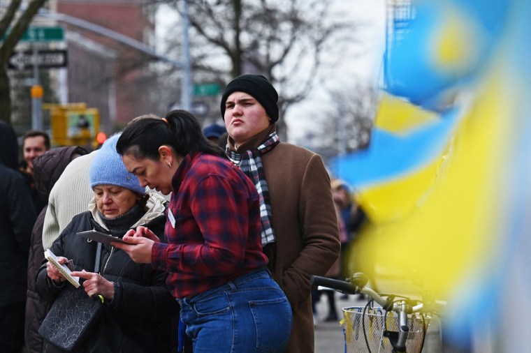Ukrainian refugees sign in to attend a job fair in Brooklyn