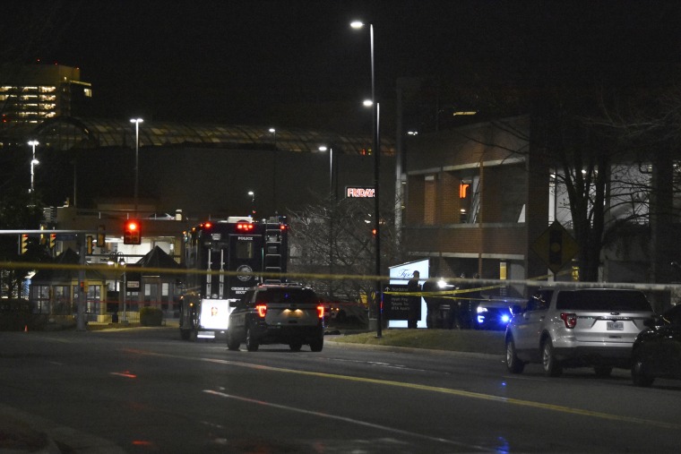 Emergency personnel work at the Tysons Corner Center mall after a person was shot and killed by police in Fairfax, Va.