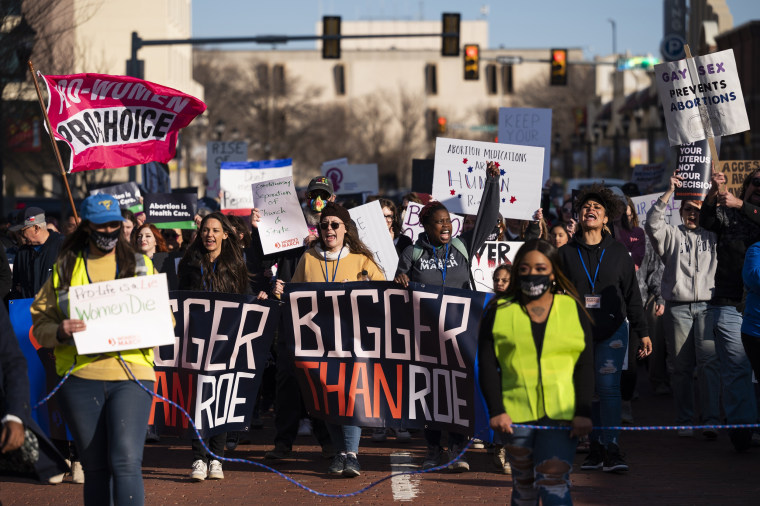 People march through downtown Amarillo, Texas to protest a lawsuit to ban the abortion drug mifepristone