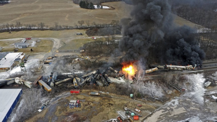 Freight cars of a Norfolk Southern train burn in East Palestine, Ohio