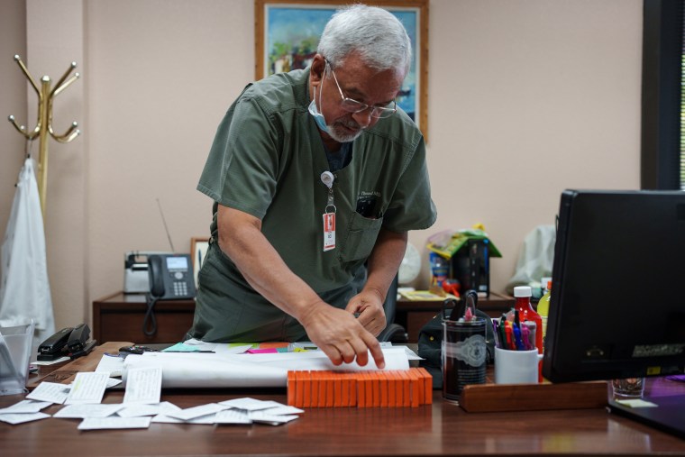 A doctor prepares doses of Mifepristone in his clinic in Santa Teresa, N.M.