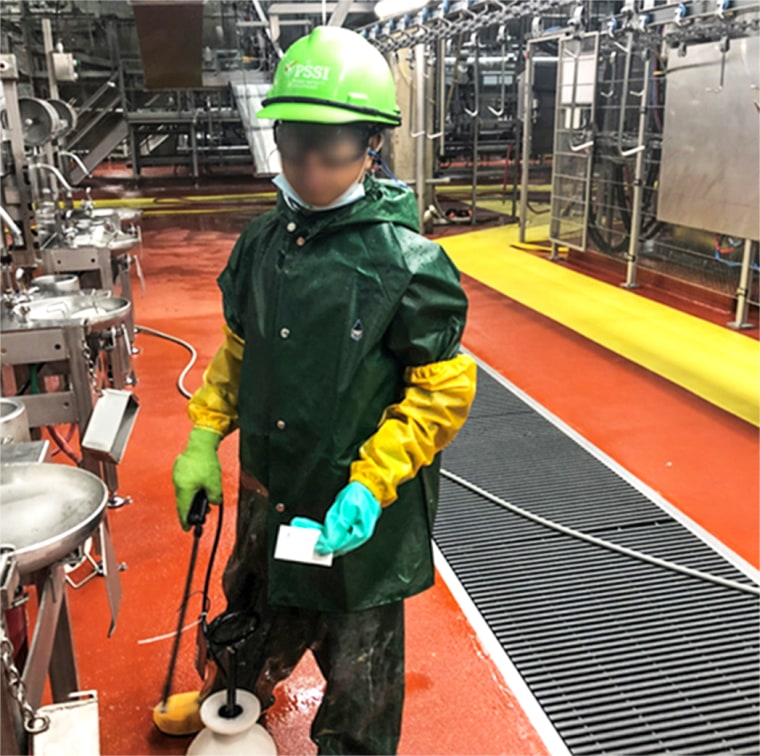 A Department of Labor investigator photographed a child who worked for Packers Sanitation Services Inc. (PSSI) cleaning a slaughterhouse in Grand Island, Nebraska. The subject has been blurred by the source.