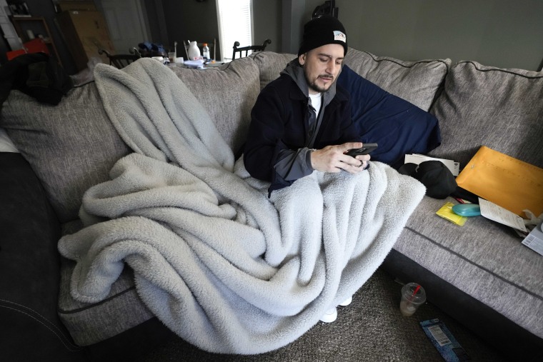 Michigan is shivering through extended power outages caused by one of the worst ice storms in decades. (AP Photo/Paul Sancya)
