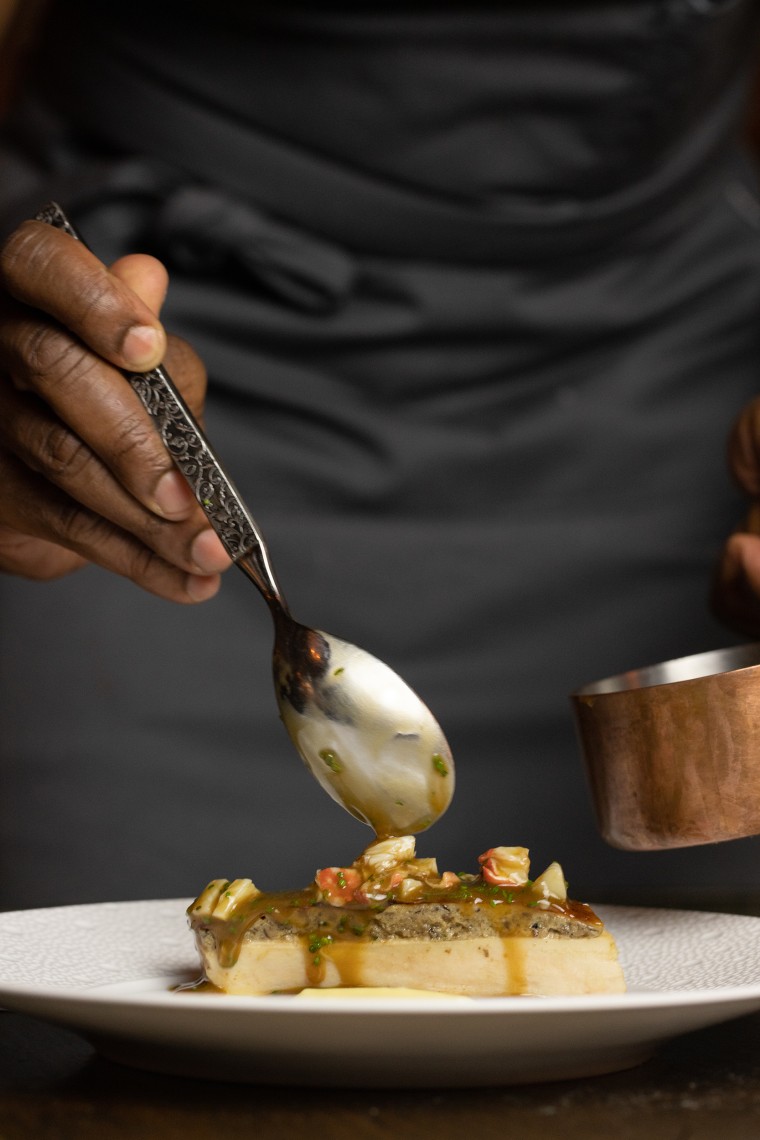 Charlie Mitchell plates a dish at Michelin-starred restaurant Clover Hill in Brooklyn Heights.