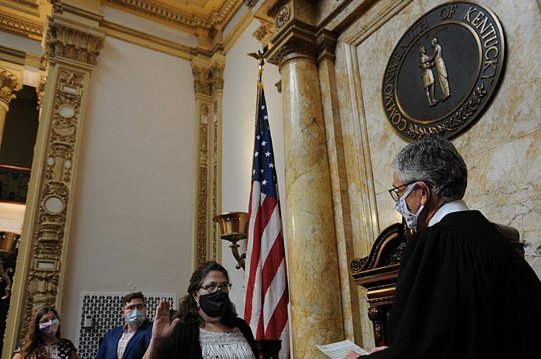 Sen. Karen Berg, being sworn into the Kentucky state Senate.