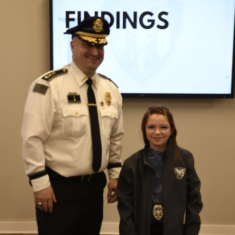 Scarlett Doumato stands with Chief Matthew Benson