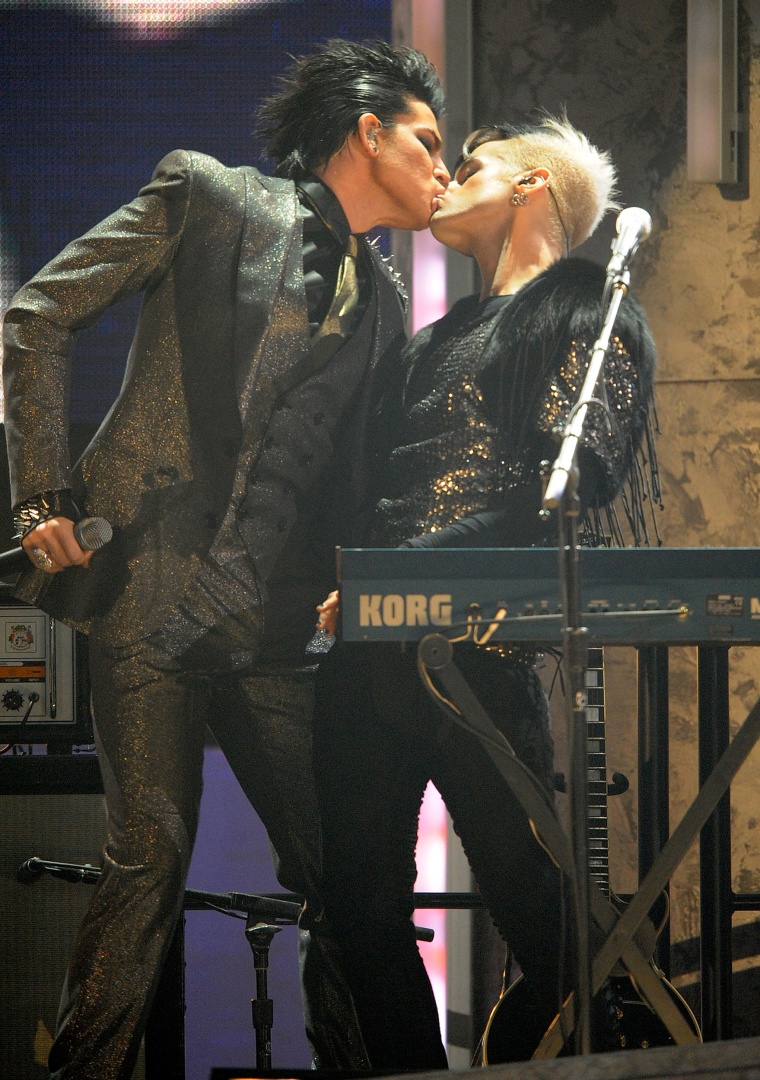 Adam Lambert (L) performs onstage at the 2009 American Music Awards