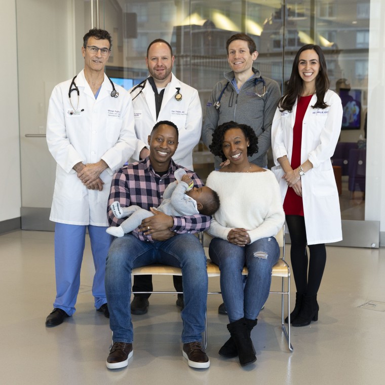 Dr. Michael Argilla, Dr. Dan Halpern, Dr. Adam Small, Jodi Feinberg, nurse practitioner with patient Marian Smith and husband Aleahue Abu and baby boy Idenara Abu.