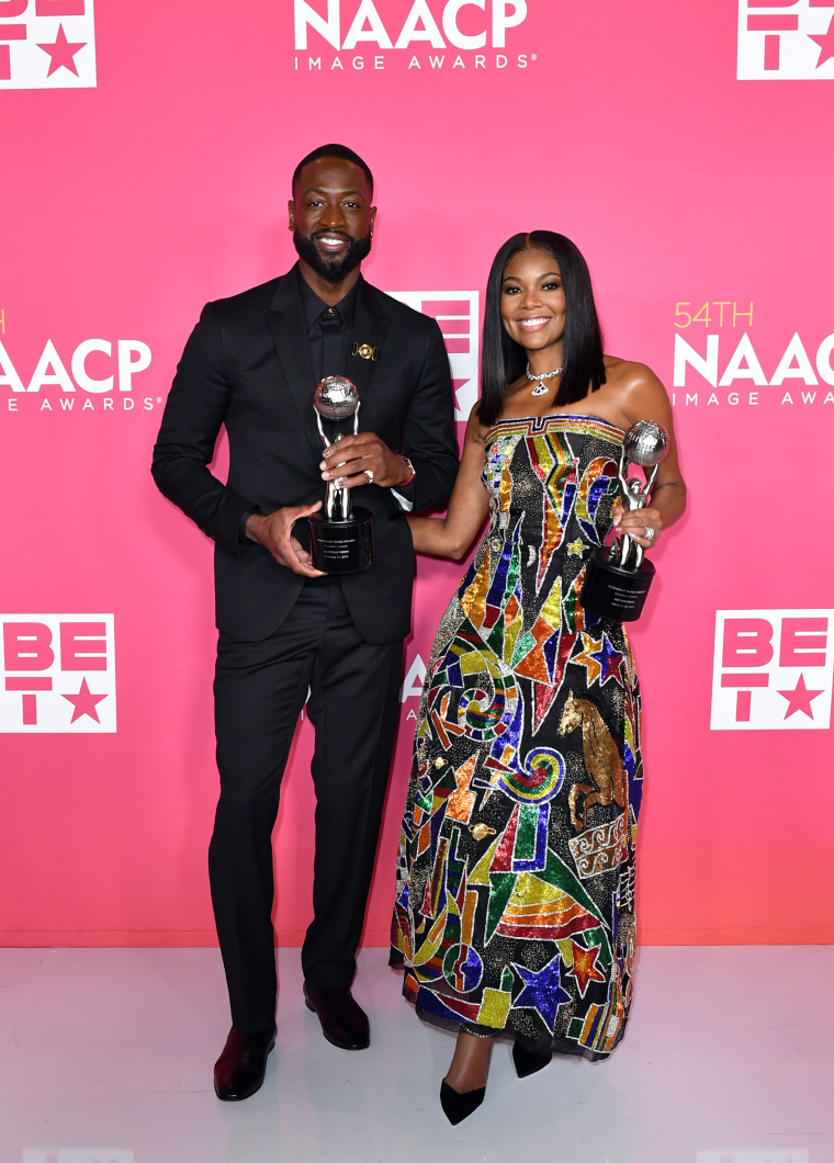 Honorees Dwyane Wade and Gabrielle Union, recipients of the President's Award, pose in the press room during the 54th NAACP Image Awards at Pasadena Civic Auditorium on February 25, 2023 in Pasadena, California.